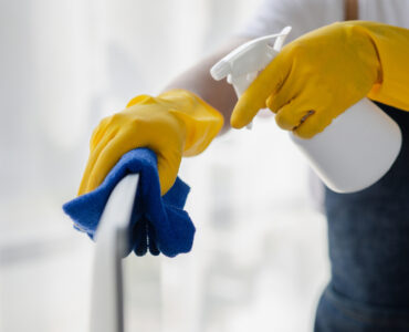 Cleaning woman housewife wash up dishes after dinner in the kitc